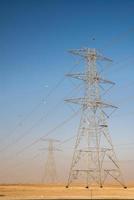Giant electricity cables in the desert photo