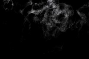 Abstract powder or smoke effect isolated on black background photo