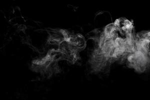 Abstract powder or smoke effect isolated on black background photo