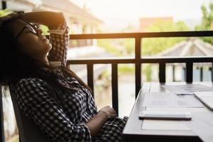 Sad woman working with laptop and document photo