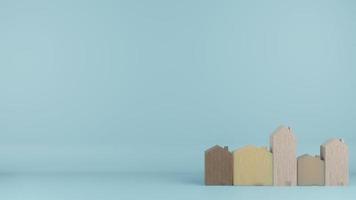 el juguete de casas de madera de varios tamaños sobre fondo de color azul 3d renderizado foto