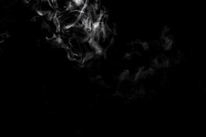 Abstract powder or smoke effect isolated on black background photo