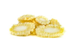 baby corn sliced isolated on white background photo