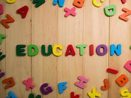 wood alphabet multi color on table for education or kid concept photo