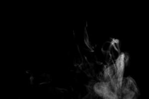 Abstract powder or smoke effect isolated on black background photo