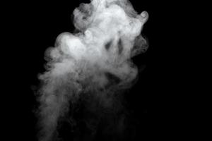 Abstract powder or smoke effect isolated on black background photo