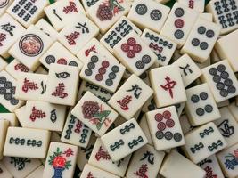 The mahjong on table ancient asian board game close up image photo