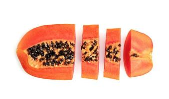 Ripe papaya slice isolated on white background photo