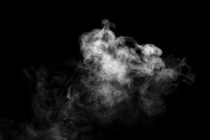 Abstract powder or smoke effect isolated on black background photo