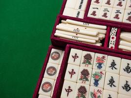 The mahjong on table ancient asian board game close up image photo