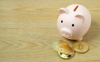 A piggy bank on wood table for  Finance or saving money business content. photo