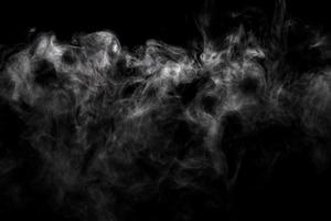 Abstract powder or smoke effect isolated on black background photo