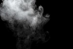 Abstract powder or smoke effect isolated on black background photo