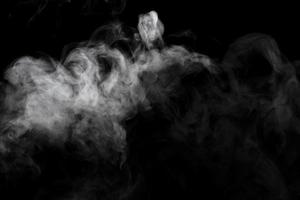 Abstract powder or smoke effect isolated on black background photo