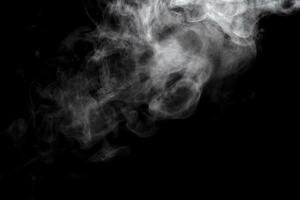 Abstract powder or smoke effect isolated on black background photo