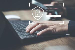 cyber security concept man's hand using a smartphone to the system through the fingerprint scanner Store data into online Cloud Data storag for security. photo