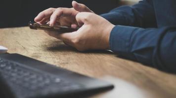 echnology concept social media man using smart phon access online media Through the Internet, there is marketing to answer customer chats. by working at home photo