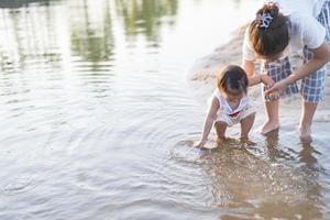 Portrait of happy loving mother and her baby outdoors. photo