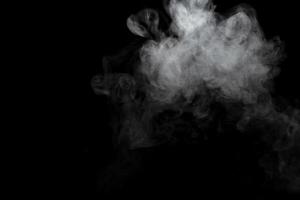 Abstract powder or smoke effect isolated on black background photo