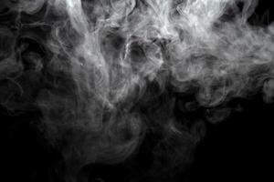 Abstract powder or smoke effect isolated on black background photo