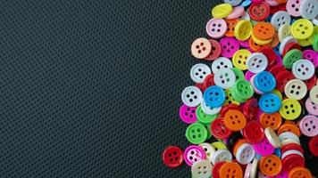 The Buttons multi colour  on black background for abstract concept photo