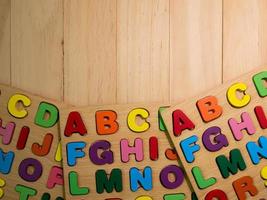 wood alphabet multi color on table for education or kid concept photo