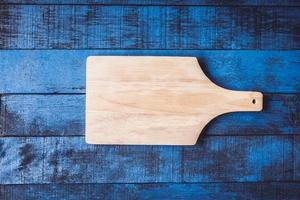 Top view of  wooden tray on bule wooden table background. photo