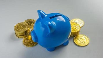 The blue piggy bank on white background for saving or business concept photo