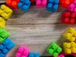 The plastic toy brick on wood table photo