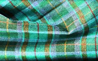 Detailed close up view on samples of cloth and fabrics in different colors found at a fabrics market photo