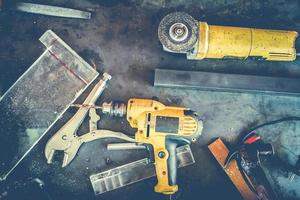 Many Tools on grunge table.View from above. Copy space. photo