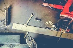 Many Tools on grunge table.View from above. Copy space. photo