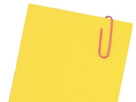 Yellow paper list. Checklist, office template, paper with pink clip. Border. background. photo