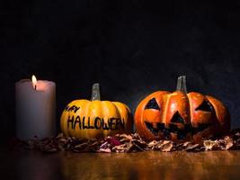 Halloween pumpkins with candlelight on dark background. photo