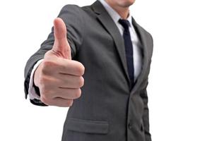 Businessman showing thumbs up isolated on white background. photo