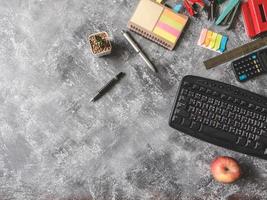 Top view of Office supplies on Grunge gray background, Free space for text photo