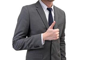 Businessman showing thumbs up isolated on white background. photo