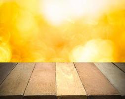 Empty wooden table in front of bokeh lights background. photo