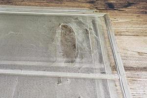 The damaged mosquito wire screen which need to be fixed photo