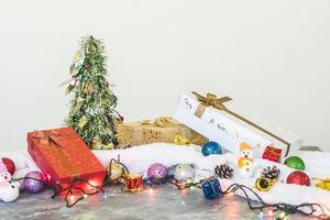 Gift boxes with Christmas decoration on the table. photo