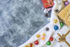 Top view of Gift boxes with Christmas decoration on gray grunge background. photo