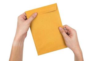 Hands holding envelope isolated on white background. photo