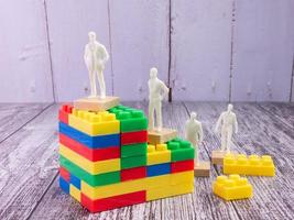 business figure and puzzle block multicolour  for strategy concept photo