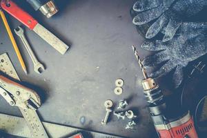 Many Tools on grunge table.View from above. Copy space. photo