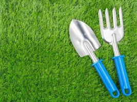 garden tools on grass background. photo