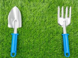 garden tools on grass background. photo