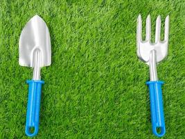 garden tools on grass background. photo