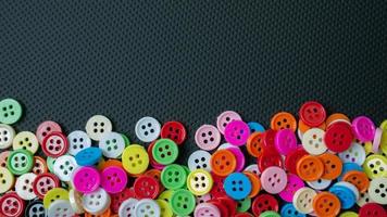 The Buttons multi colour  on black background for abstract concept photo