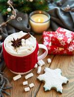 hot chocolate with marshmallows and gingerbread cookie photo