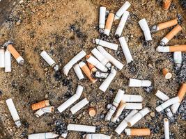 Smoked Cigarettes Butts in ashtray photo